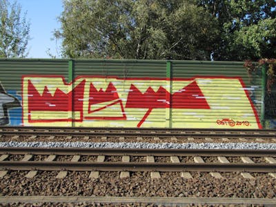 Red and Yellow Handstyles by urine, Pizar and OST. This Graffiti is located in Leipzig, Germany and was created in 2010. This Graffiti can be described as Handstyles and Line Bombing.