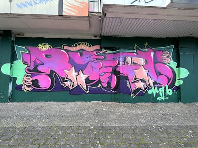 Violet and Cyan and Coralle Stylewriting by Radikalinski. This Graffiti is located in mönchengladbach, Germany and was created in 2023. This Graffiti can be described as Stylewriting and Characters.