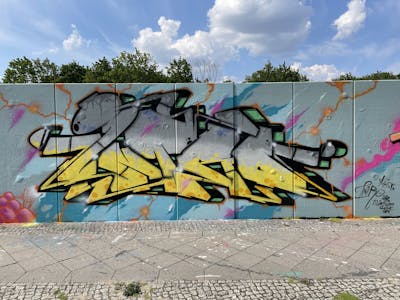 Grey and Yellow and Colorful Stylewriting by Intro. This Graffiti is located in Berlin, Germany and was created in 2023. This Graffiti can be described as Stylewriting and Wall of Fame.