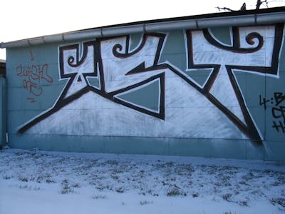 Chrome and Black Stylewriting by urine and OST. This Graffiti is located in Delitzsch, Germany and was created in 2005. This Graffiti can be described as Stylewriting and Street Bombing.