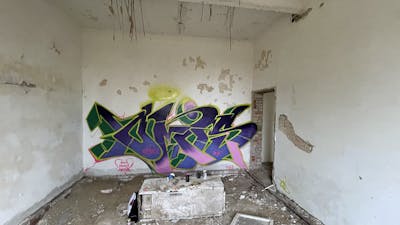 Light Green and Violet and Colorful Stylewriting by Czosen1. This Graffiti is located in Bartoszyce, Poland and was created in 2023. This Graffiti can be described as Stylewriting and Abandoned.