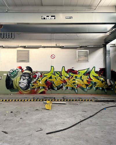 Light Green and Grey and Red Stylewriting by Tokk and Amen. This Graffiti is located in Germany and was created in 2023. This Graffiti can be described as Stylewriting, Characters and Abandoned.