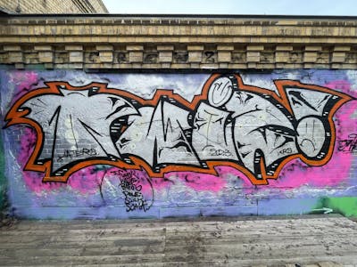 Chrome and Orange Stylewriting by Twis. This Graffiti is located in Leipzig, Germany and was created in 2023. This Graffiti can be described as Stylewriting and Wall of Fame.