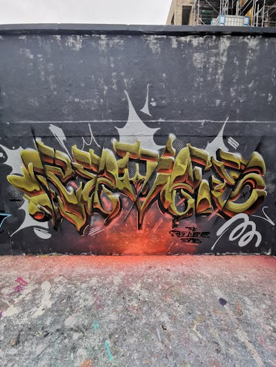 Grey and Orange Stylewriting by REVES ONE. This Graffiti is located in United Kingdom and was created in 2023. This Graffiti can be described as Stylewriting and Wall of Fame.
