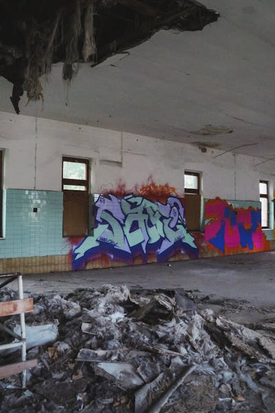 Cyan and Violet and Blue Stylewriting by Safi. This Graffiti is located in Germany and was created in 2023. This Graffiti can be described as Stylewriting, Abandoned and Atmosphere.