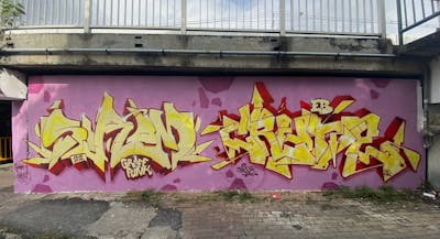 Yellow and Coralle and Red Stylewriting by Sirom and Crude. This Graffiti is located in Bangkok, Thailand and was created in 2022.