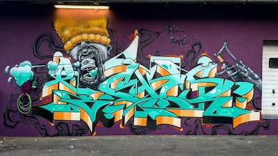 Cyan and Orange Stylewriting by Picks and Diro. This Graffiti is located in Saalfeld, Germany and was created in 2022. This Graffiti can be described as Stylewriting, Characters and Wall of Fame.