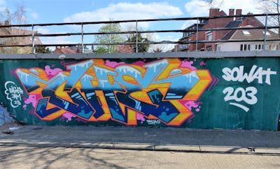 Light Blue and Blue and Orange Stylewriting by CHE. This Graffiti is located in Hasselt, Belgium and was created in 2023. This Graffiti can be described as Stylewriting and Wall of Fame.