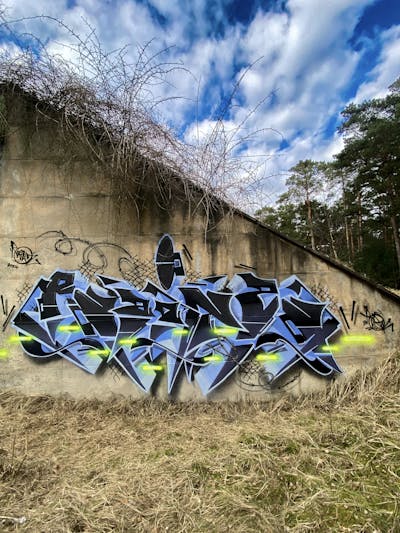 Light Blue and Black Stylewriting by Raitz. This Graffiti is located in Germany and was created in 2024. This Graffiti can be described as Stylewriting, Atmosphere and Abandoned.