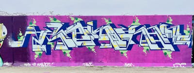 Light Blue and Violet Stylewriting by Vino AAA. This Graffiti is located in Essex, United Kingdom and was created in 2022. This Graffiti can be described as Stylewriting and Wall of Fame.