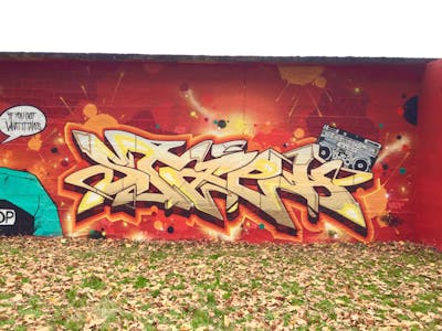 Red and Beige Stylewriting by Kst, Alf, Twp, Yo and STAPH. This Graffiti is located in Saint-Etienne, France and was created in 2021. This Graffiti can be described as Stylewriting, Wall of Fame and Characters.
