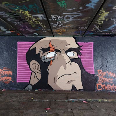 Beige and Black Characters by Senpai. This Graffiti is located in Dordrecht, Netherlands and was created in 2022.