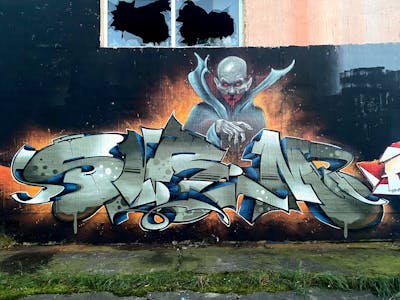 Orange and Grey and Blue Stylewriting by Sirom. This Graffiti is located in Germany and was created in 2023. This Graffiti can be described as Stylewriting, Characters and Abandoned.