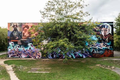 Cyan and Violet and Orange Murals by Graff.Funk, nex, Nexgraff, Wok, Chiesz, Stick, Aser, MIREA and Chr15. This Graffiti is located in Leipzig, Germany and was created in 2023. This Graffiti can be described as Murals, Stylewriting and Characters.