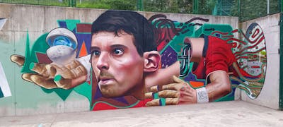 Cyan and Colorful Characters by Nexgraff. This Graffiti is located in donostia, Spain and was created in 2022. This Graffiti can be described as Characters, Murals and 3D.