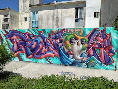Colorful Stylewriting by Ron-E-Rox. This Graffiti is located in Playa del Carmen, Mexico and was created in 2021. This Graffiti can be described as Stylewriting, Characters and Wall of Fame.