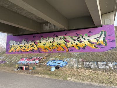 Yellow and Violet Stylewriting by ZICK, BERS, Rowdy and PMZ CREW. This Graffiti is located in Meppen, Germany and was created in 2022.