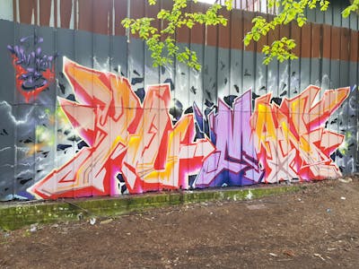 Beige and Red and Colorful Stylewriting by Hu-Man. This Graffiti is located in Hamburg, Germany and was created in 2023.