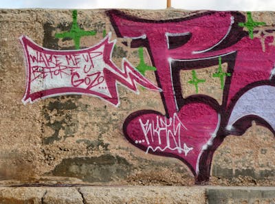 Red and White Graffiti by Riots. This Graffiti is located in Malta and was created in 2011.