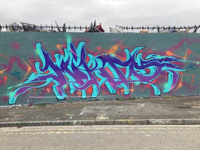 Cyan and Violet Stylewriting by Micro 79. This Graffiti is located in Newcastle, United Kingdom and was created in 2023. This Graffiti can be described as Stylewriting and Wall of Fame.