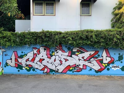Red and Light Blue and Chrome Stylewriting by Crude. This Graffiti is located in Bangkok, Thailand and was created in 2020.