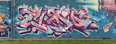 Coralle and Light Blue and Colorful Stylewriting by DCK, Elmo and ALL CAPS COLLECTIVE. This Graffiti is located in Hungary and was created in 2020. This Graffiti can be described as Stylewriting and Wall of Fame.
