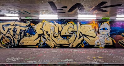 Gold and Colorful Stylewriting by Pase. This Graffiti is located in United Kingdom and was created in 2023. This Graffiti can be described as Stylewriting, Characters and Wall of Fame.