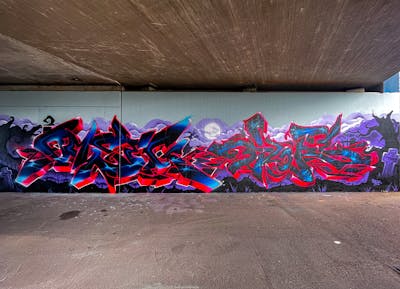 Red and Blue Stylewriting by omseg. This Graffiti is located in Freiburg, Germany and was created in 2023. This Graffiti can be described as Stylewriting and Wall of Fame.