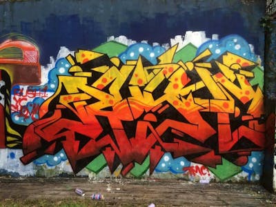 Orange and Yellow Stylewriting by Rush One. This Graffiti is located in Yangon city, Myanmar and was created in 2014.
