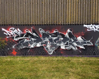 Grey and Black and Red Stylewriting by Posa. This Graffiti is located in Bremerhaven, Germany and was created in 2021.