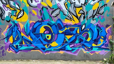 Yellow and Blue Stylewriting by NOIZ. This Graffiti is located in Jakarta, Indonesia and was created in 2022. This Graffiti can be described as Stylewriting and Futuristic.