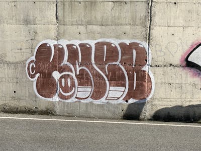 Brown and White Stylewriting by KNEB. This Graffiti is located in Cyprus and was created in 2022. This Graffiti can be described as Stylewriting, Street Bombing and Throw Up.