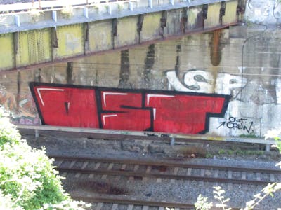 Red and Black Stylewriting by urine, Pizar and OST. This Graffiti is located in Leipzig, Germany and was created in 2013. This Graffiti can be described as Stylewriting and Line Bombing.