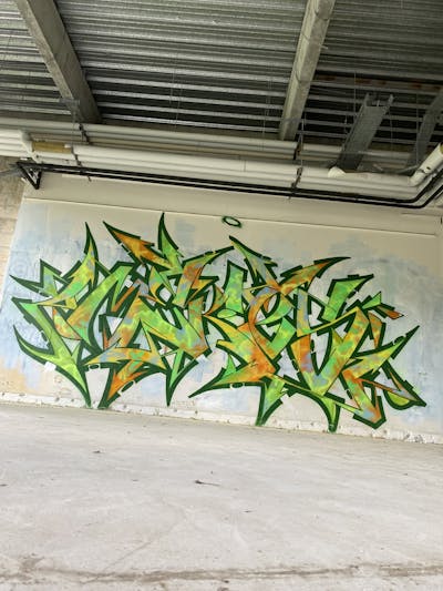 Green and Orange Stylewriting by _mekes_. This Graffiti is located in France and was created in 2023. This Graffiti can be described as Stylewriting and Abandoned.