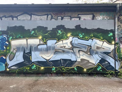 Grey and Light Blue Stylewriting by Muser. This Graffiti is located in Leipzig, Germany and was created in 2024. This Graffiti can be described as Stylewriting and Wall of Fame.