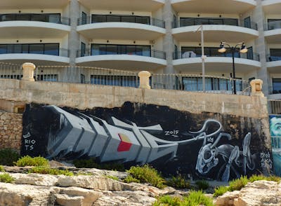 Grey Characters by Riots. This Graffiti is located in Malta and was created in 2015. This Graffiti can be described as Characters, 3D and Street Bombing.