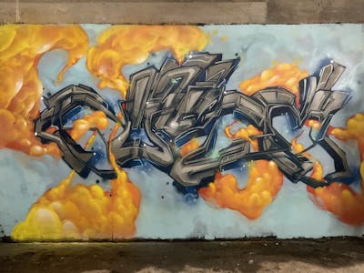 Grey and Orange and Light Blue Stylewriting by Niser. This Graffiti is located in Carcassonne, France and was created in 2023.