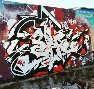 Red and Black and Chrome Stylewriting by SAO2971. This Graffiti is located in St helier, Jersey and was created in 2023.