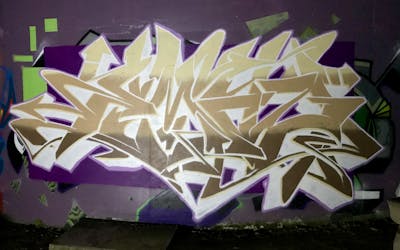 Beige and Violet Stylewriting by EmzG. This Graffiti is located in Zug, Switzerland and was created in 2022. This Graffiti can be described as Stylewriting and Wall of Fame.