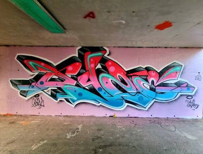 Red and Coralle and Light Blue Stylewriting by Dyze. This Graffiti is located in Bern, Switzerland and was created in 2023. This Graffiti can be described as Stylewriting and Wall of Fame.