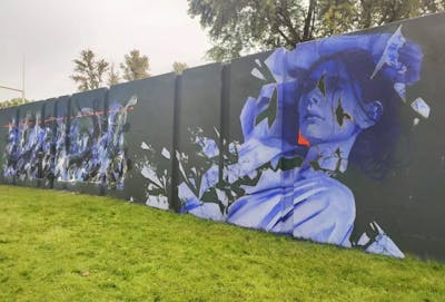 Violet Characters by Iota. This Graffiti is located in Eindhoven, Netherlands and was created in 2021. This Graffiti can be described as Characters and Murals.