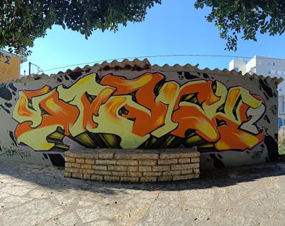 Orange and Yellow and Black Stylewriting by SparkTwo. This Graffiti is located in Agrinio, Greece and was created in 2023. This Graffiti can be described as Stylewriting and Street Bombing.