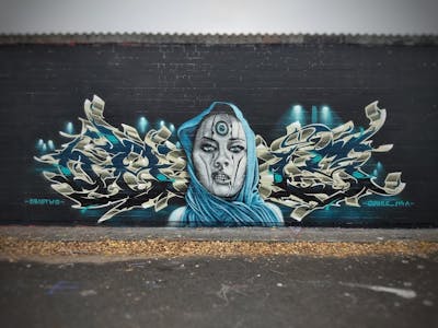 Blue and Beige Stylewriting by CUORE and Obistwo. This Graffiti is located in Berlin, Germany and was created in 2021. This Graffiti can be described as Stylewriting, Characters and Wall of Fame.