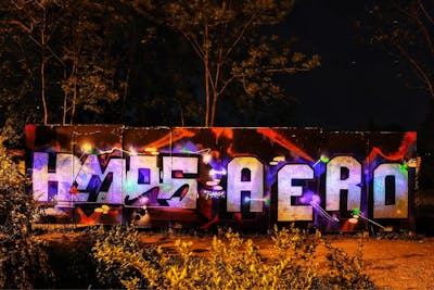 Chrome and Colorful Stylewriting by Hmas and Aero. This Graffiti is located in Miami Pieschen, Germany and was created in 2021.