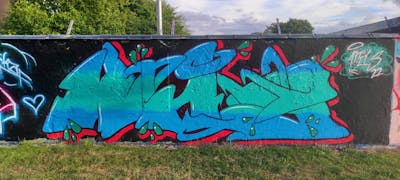 Light Blue and Red Stylewriting by Mils. This Graffiti is located in Germany and was created in 2022. This Graffiti can be described as Stylewriting and Wall of Fame.