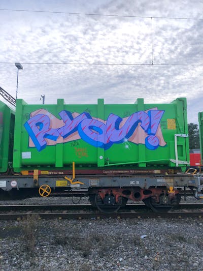 Light Green and Violet Trains by Ryos. This Graffiti is located in Lausanne, Switzerland and was created in 2021. This Graffiti can be described as Trains and Stylewriting.