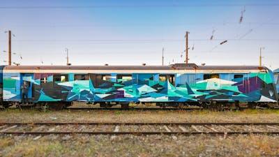 Light Green and Light Blue Stylewriting by Dr Clark. This Graffiti is located in Metz, France and was created in 2020. This Graffiti can be described as Stylewriting, Futuristic, Trains and Wholecars.