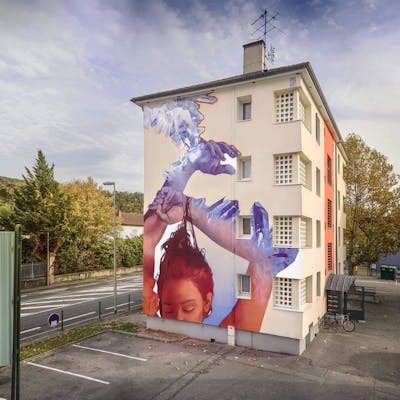 Violet and Orange Characters by Iota. This Graffiti is located in grenobles, France and was created in 2020. This Graffiti can be described as Characters, Futuristic and Murals.