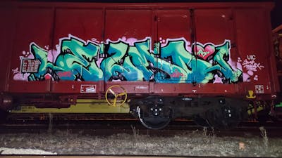 Cyan Stylewriting by DCK, Elmo and ALL CAPS COLLECTIVE. This Graffiti is located in Hungary and was created in 2021. This Graffiti can be described as Stylewriting, Trains and Freights.