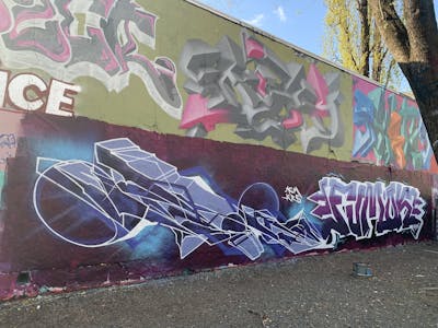 Violet and Colorful Stylewriting by Fumok and Floyd. This Graffiti is located in Dresden, Germany and was created in 2021. This Graffiti can be described as Stylewriting and Wall of Fame.
